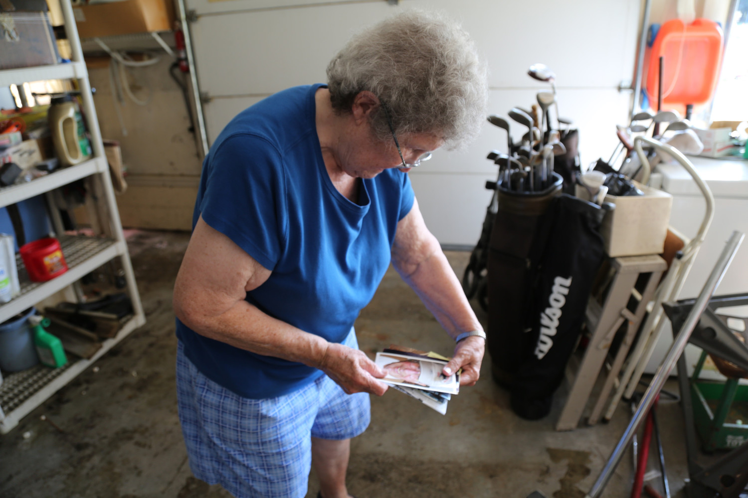 Nancy Sciara of New Bern, North Carolina looks at photos Sept. 22 at her home that were not ruined during Hurricane Florence. Here she looks at a photo of her husband, Frank, who died four days before the storm.